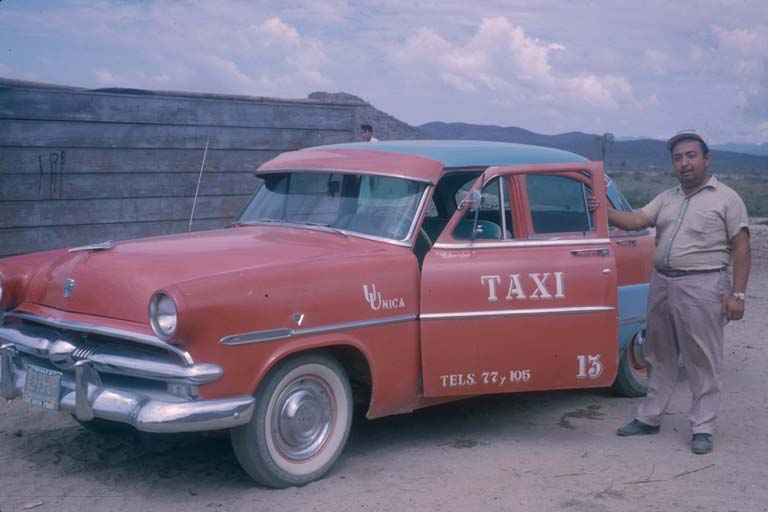 Eduardo Castro S. & his taxi Punta de Lobos, October 12, 1964