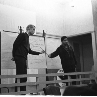 LeRoy Chatfield & Cesar Chavez take turns explaining the UFW\'s Robert F. Kennedy Medical Plan at a union membership meeting./ Photo by Nick Jones